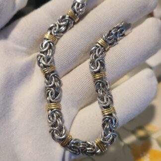 925 sterling silver and 14k gold byzantine 8" bracelet.